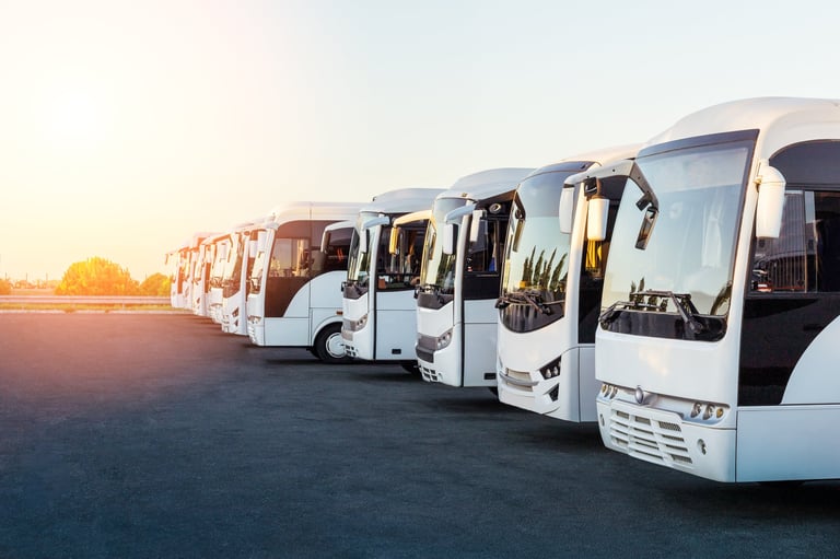 Tourist buses on parking at sunrise